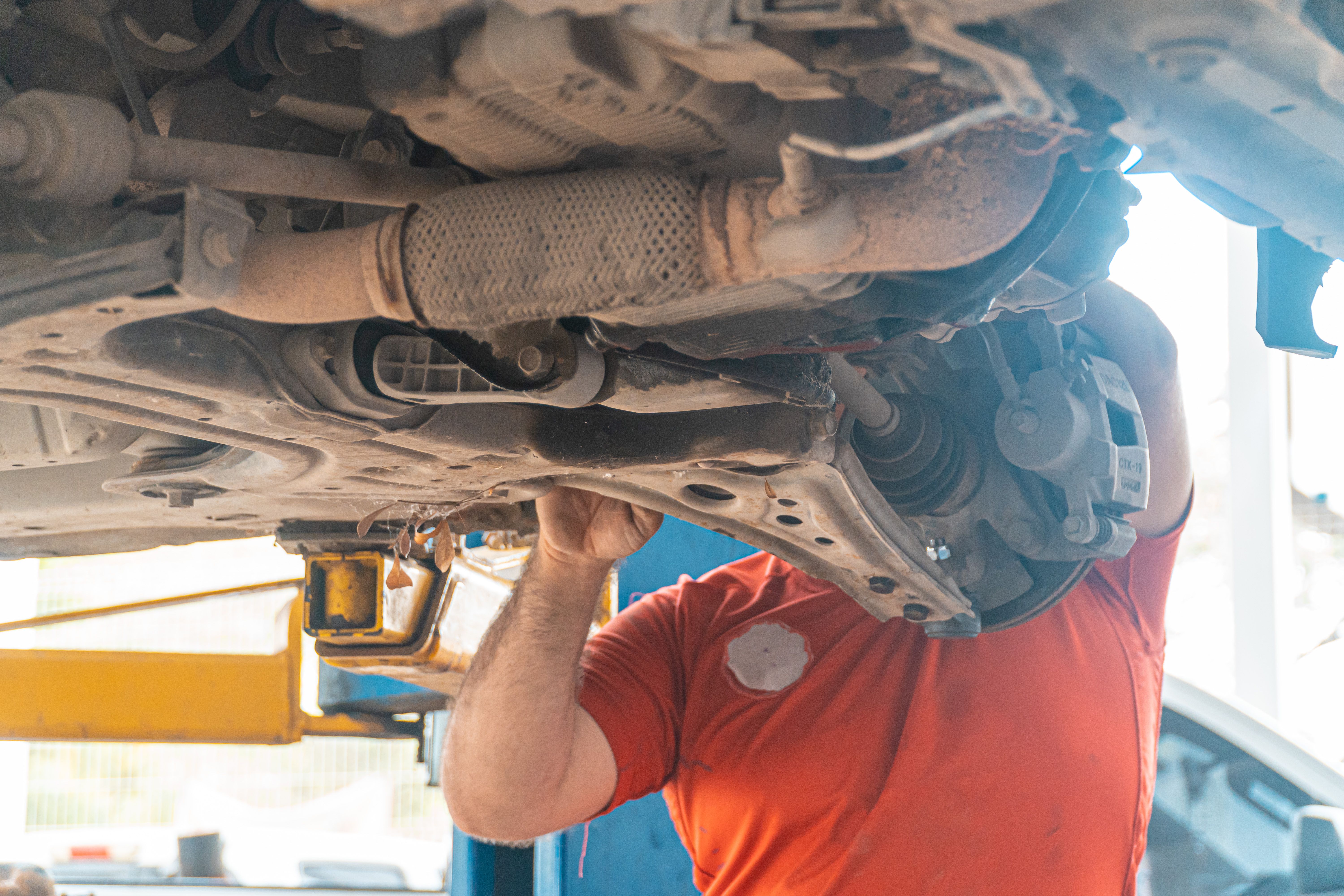 Professional auto technician working on vehicle