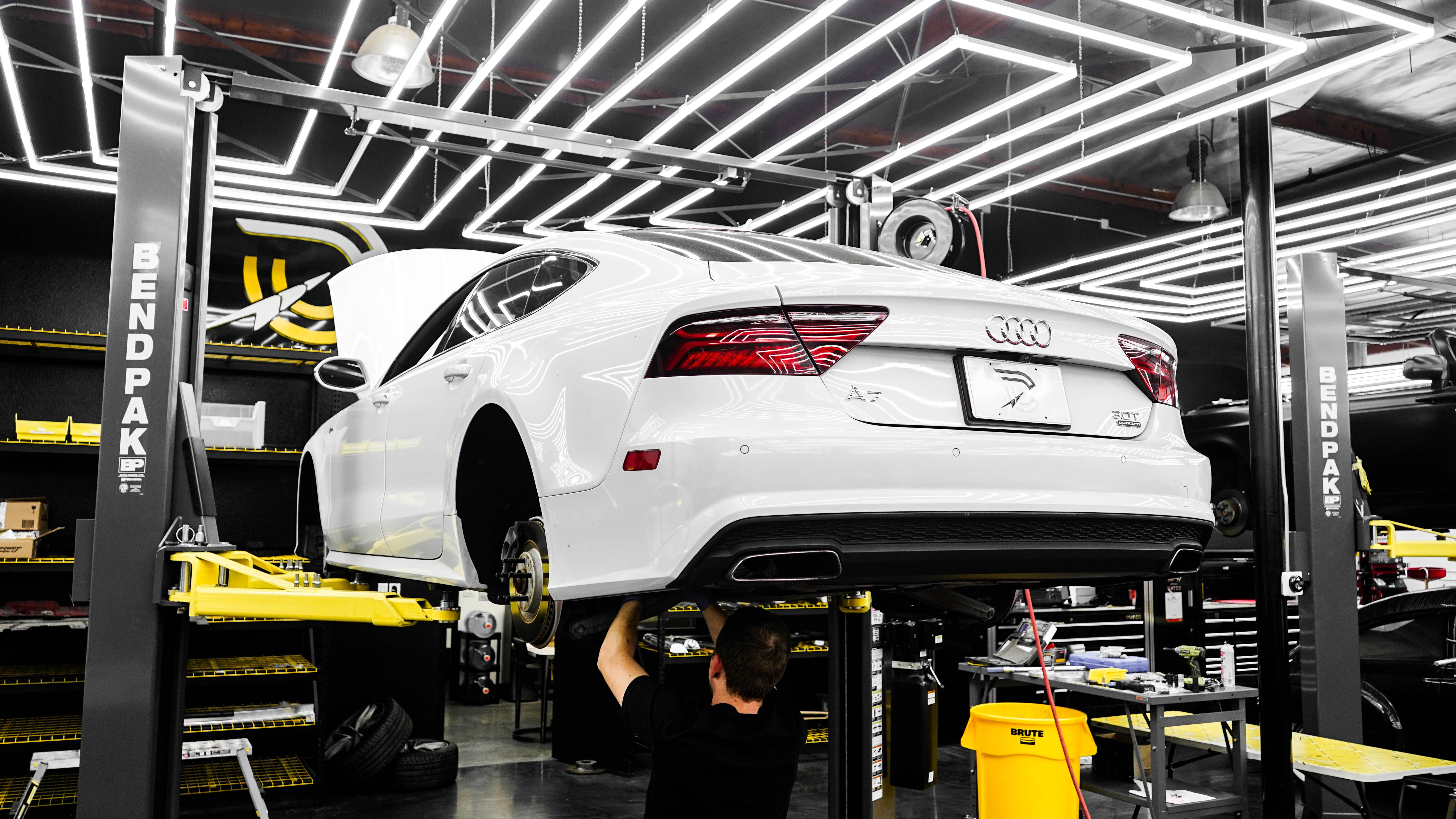 Vehicle suspension and steering components being serviced